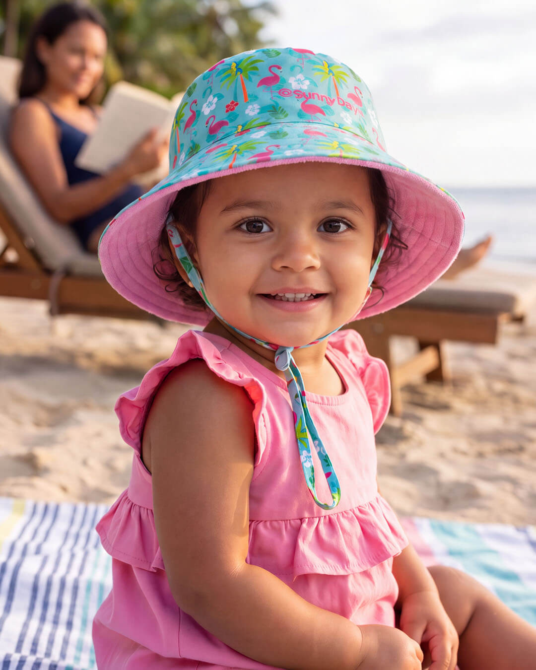 Child wearing a Sun N Sand kids' sun hat
